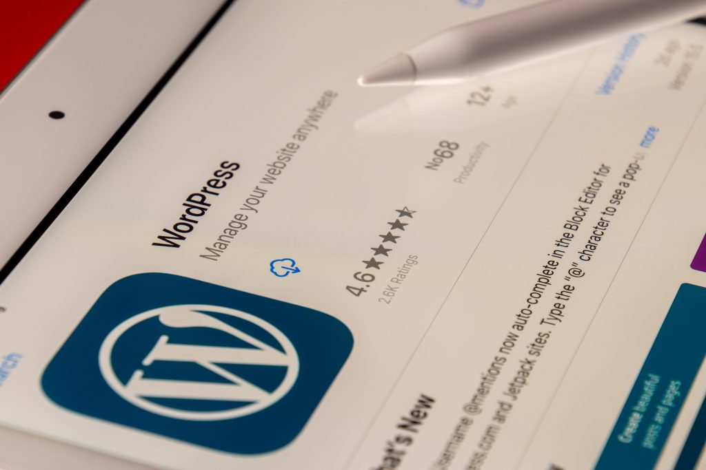 Wordpress screen showing on a tablet with a stylus resting on the image. Image by Souvik Banerjee.