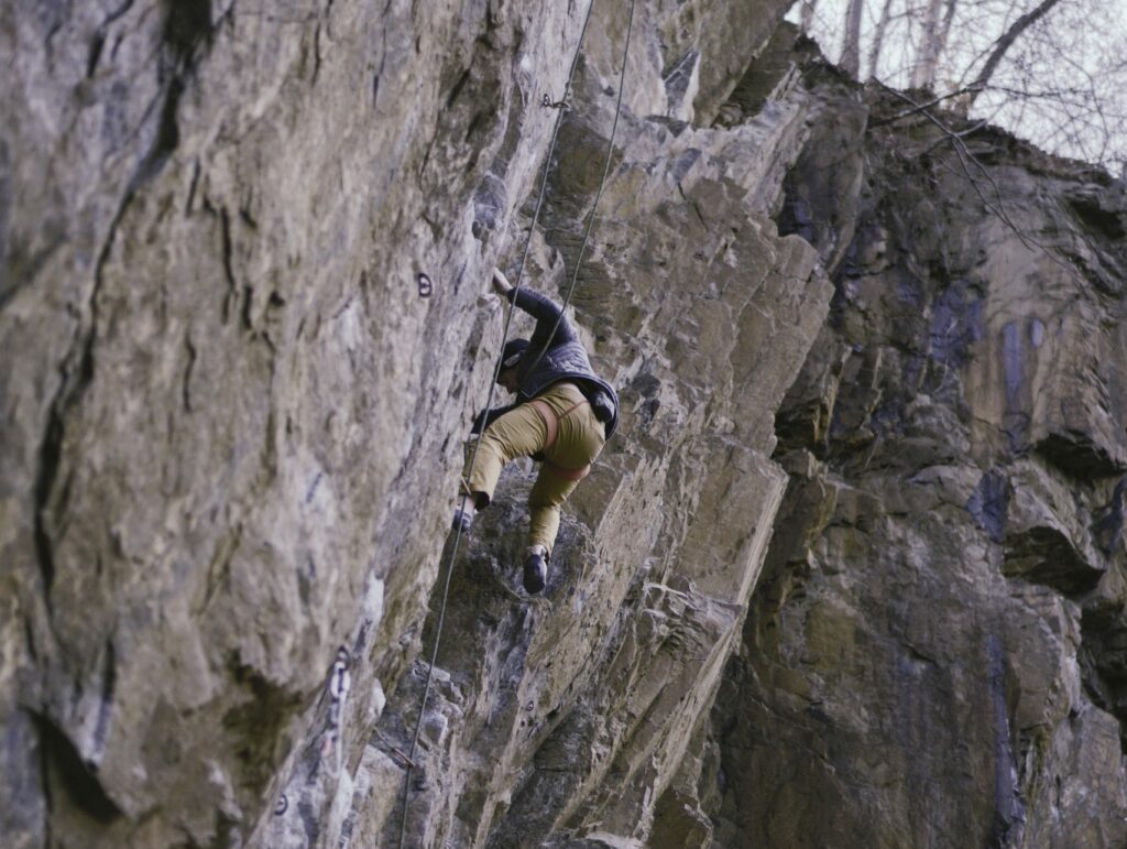 A person climbing a rock. Digiboost offers the best Well-Architected Review for your business.